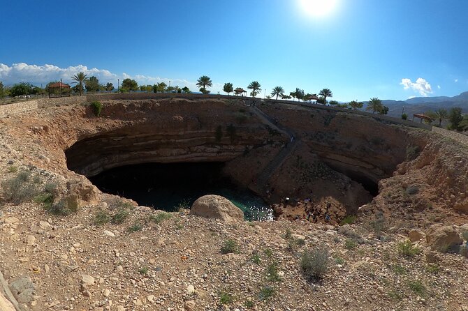 Full-day Private Guided Wadi Shab Tour in Oman - Swimming toward the Keyhole cave