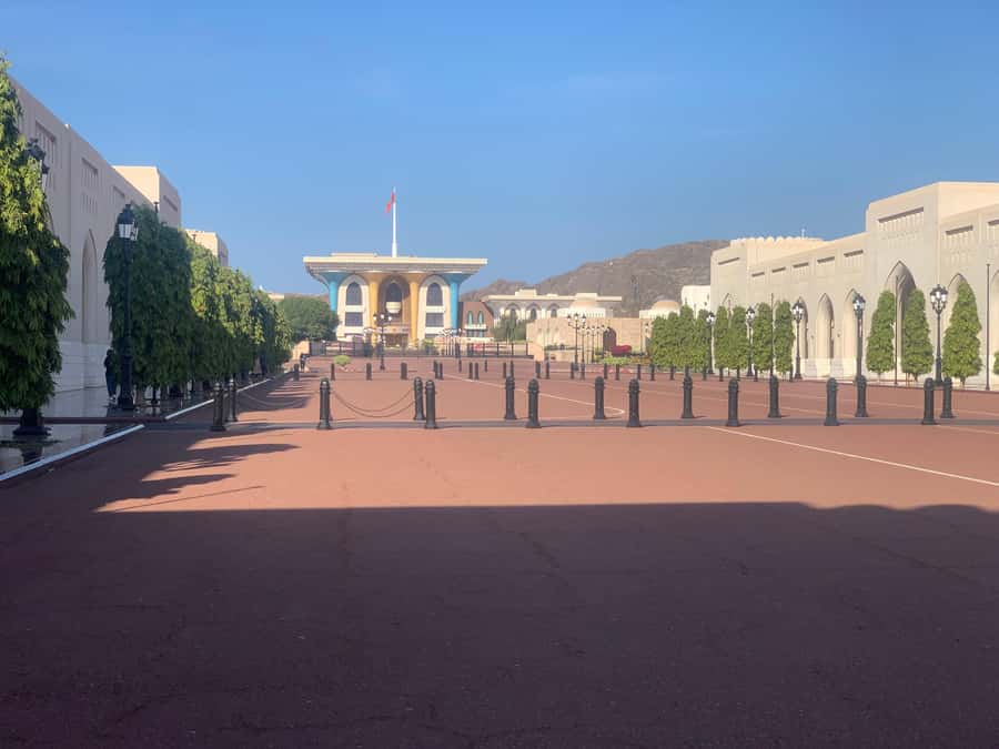 Muscat: Evening Group City Guided Tour with Free Dinner - Muscat after dark, with the driving handled