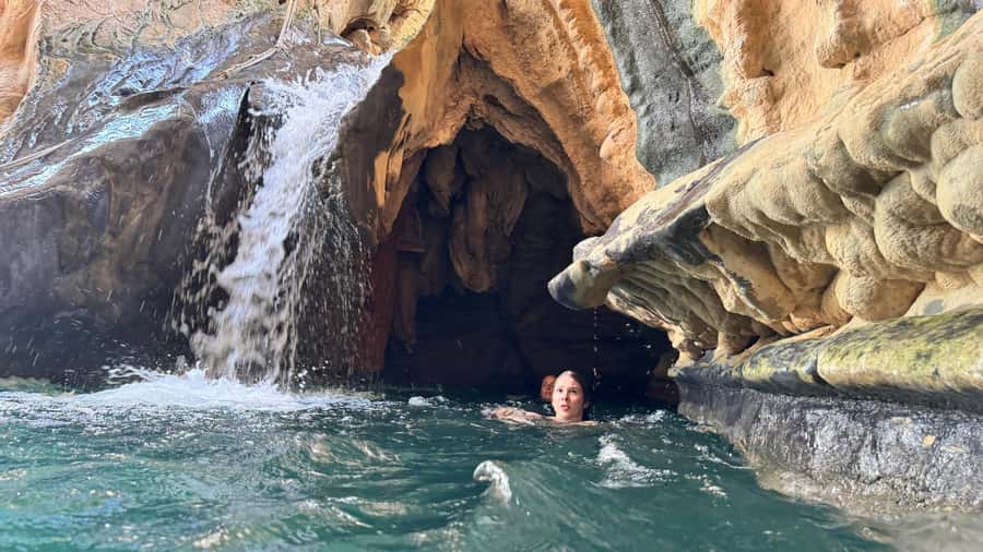 Oman’s Hidden Gems: Wadi Shab & Bimmah Sinkhole - Swimming through three pools toward the cave