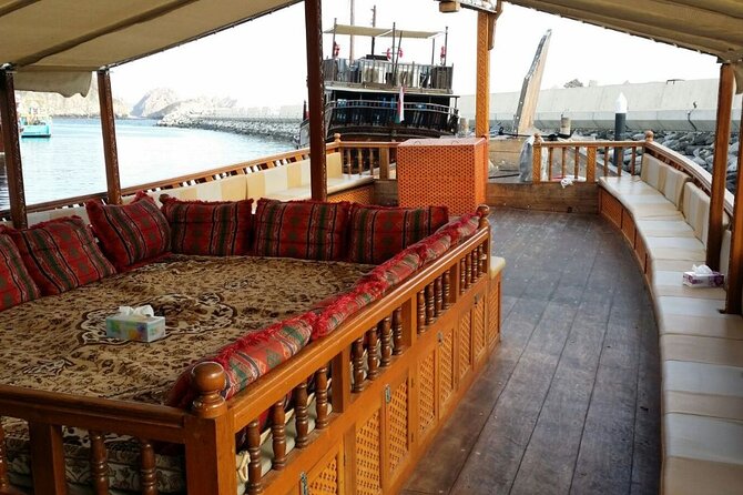 Omani Traditional Dhow Cruise: Sunset and Muscat Coastal View - A sea view of Al Alam Palace