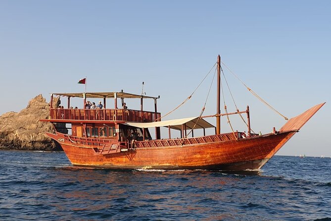 Omani Traditional Dhow Cruise: Sunset and Muscat Coastal View - Passing Al Bustan Palace Hotel