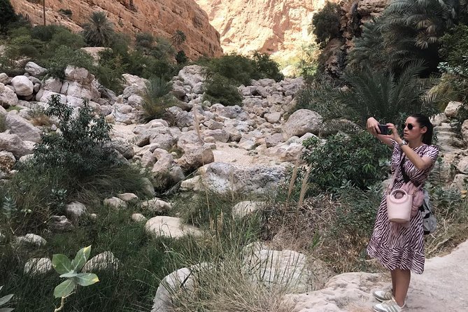 Private Day Trip to Wadi Shab & Bimmah Sinkhole Price Up To 5 Persons - Walking into Wadi Shab’s canyon