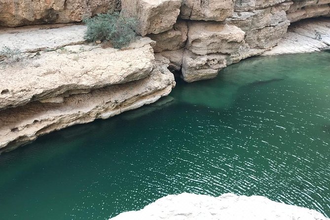 Private Day Trip to Wadi Shab, Fins Beach & Bimmah Sinkhole - Bimmah Sinkhole and its turquoise lake