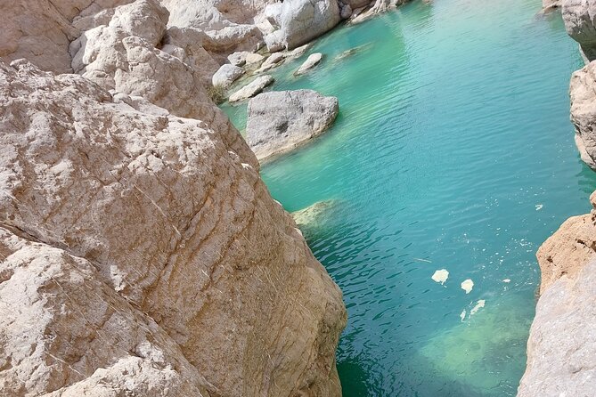 Shared Guided Canyoneering Experience in Snake Canyon of Oman - Swimming under waterfalls and sliding into pools